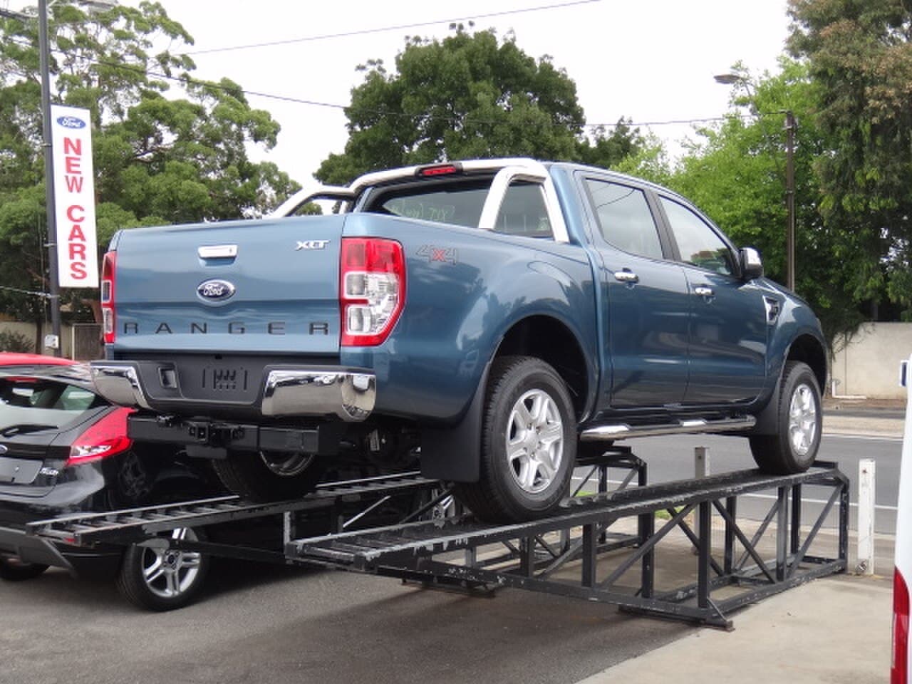 A Ford Ranger dual-cab ute parked on an Australian street