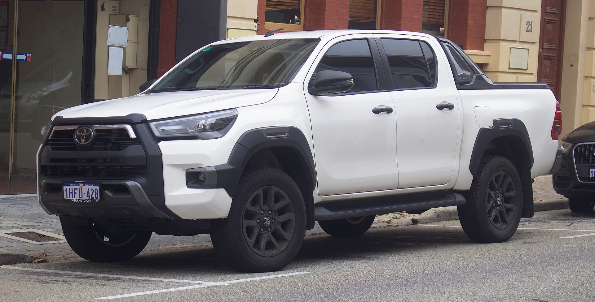A white Toyota HiLux Rogue dual-cab parked on a Fremantle street, the shape of vehicle Australians buy more of than any other
